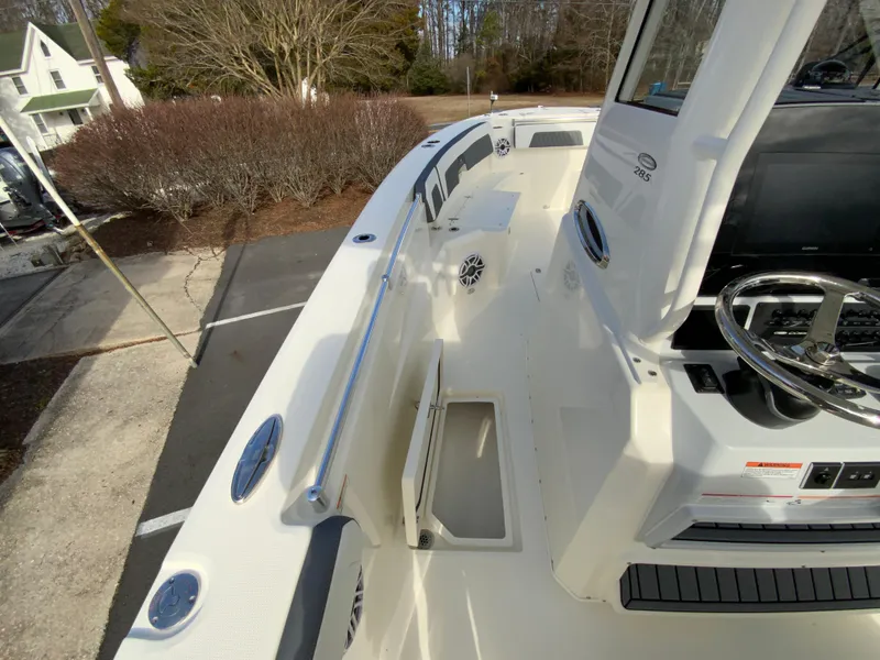 Slide: The Image of 2025 Cobia 285 Open Center Console boat, showcasing spacious deck and modern design. - 49