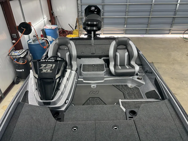 Slide: The Image of 2025 Nitro Z21 XL Pro boat interior with dual seats and storage compartments. - 10
