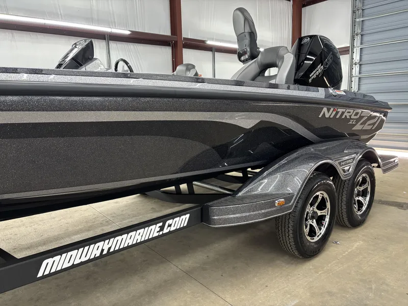 Slide: The Image of 2025 Nitro Z21 XL Pro boat on trailer in showroom. - 16