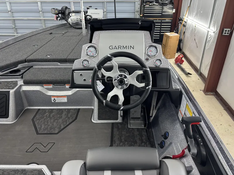 Slide: The Image of 2025 Nitro Z21 XL Pro boat cockpit with Garmin electronics and modern steering wheel. - 18