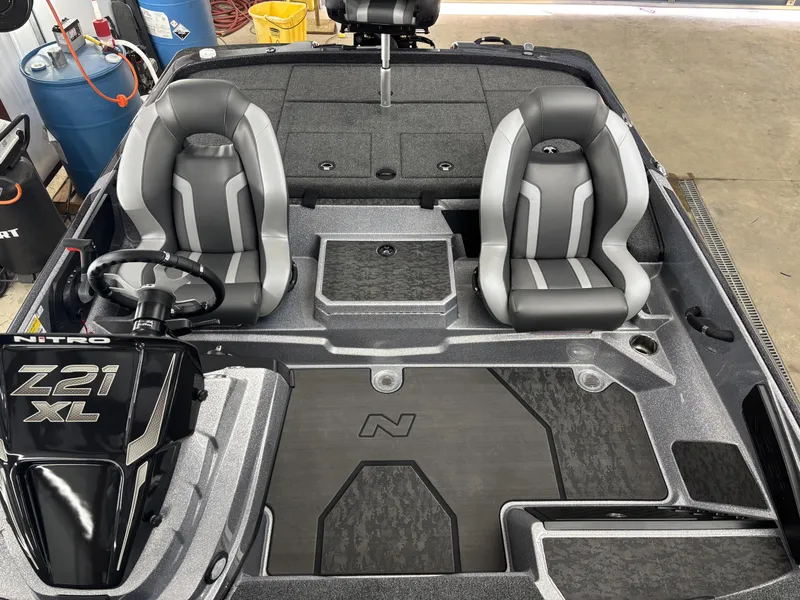 Slide: The Image of 2025 Nitro Z21 XL Pro boat interior with dual seats and steering console. - 20