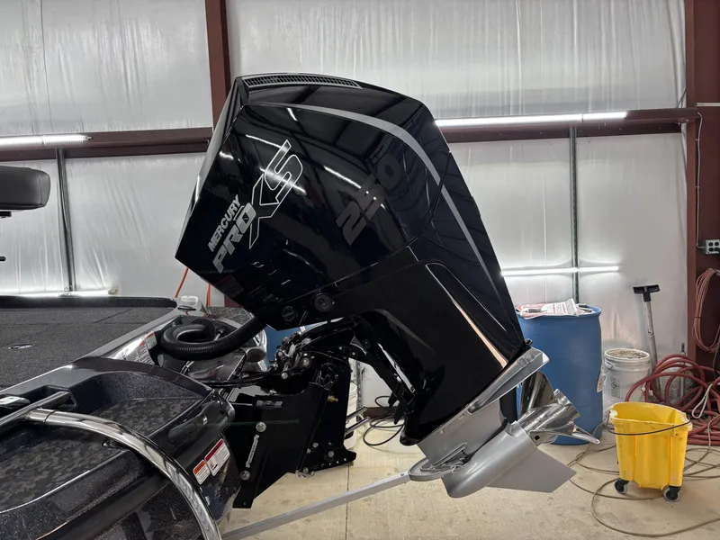 Slide: The Image of 2025 Nitro Z21 XL Pro with Mercury Pro XS engine in a garage setting. - 5