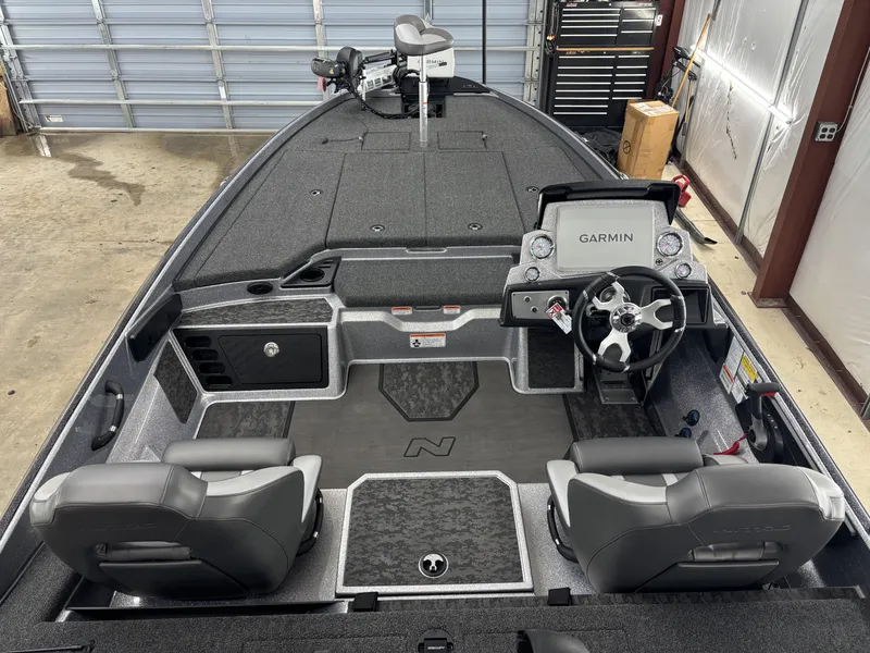 Slide: The Image of 2025 Nitro Z21 XL Pro boat interior with Garmin navigation system and dual seating. - 6