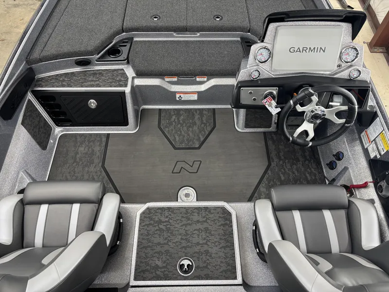 Slide: The Image of 2025 Nitro Z21 XL Pro boat interior with Garmin dashboard and dual seats. - 7