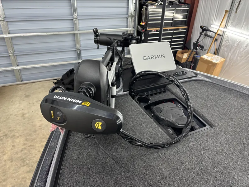 Slide: The Image of 2025 Nitro Z21 XL Pro boat with Garmin and Minn Kota Ultrex equipment in a garage. - 9