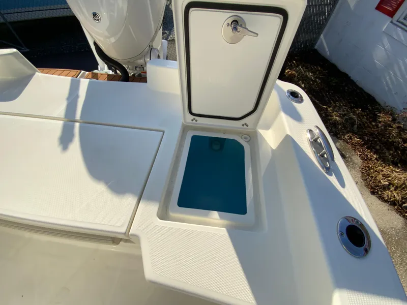 Slide: The Image of Pathfinder 2400 TRS 2025 boat with open storage compartment on deck. - 20