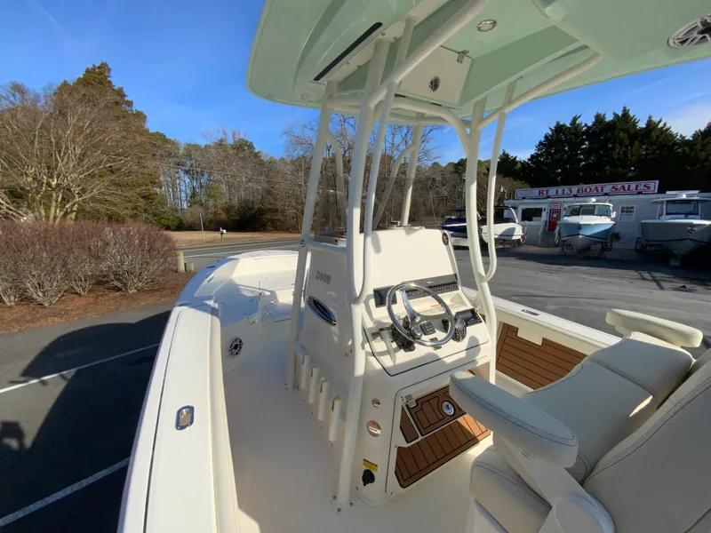 Slide: The Image of 2025 Pathfinder 2400 TRS boat interior with steering console and seating. - 22