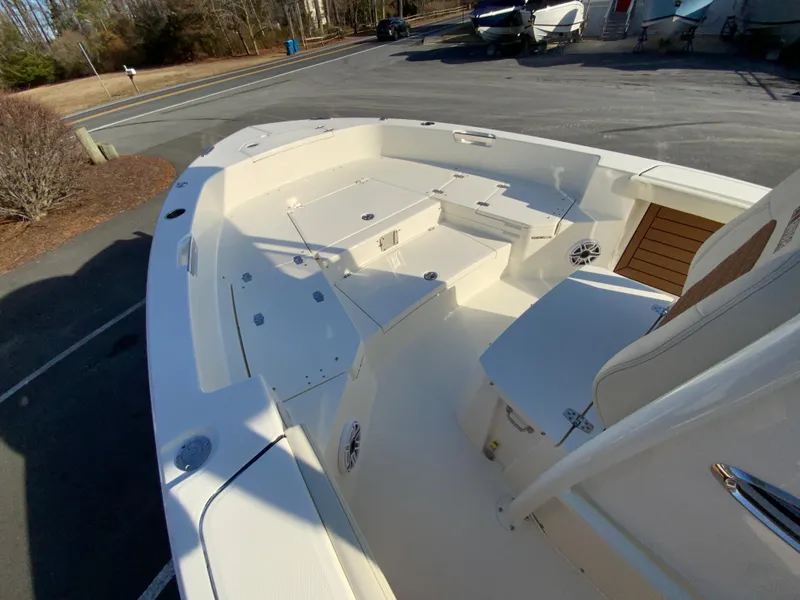 Slide: The Image of 2025 Pathfinder 2400 TRS boat with spacious deck and seating area. - 23