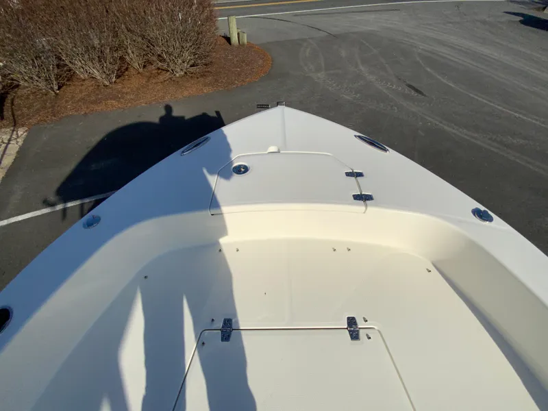 Slide: The Image of 2025 Pathfinder 2400 TRS boat bow view in a parking lot. - 25