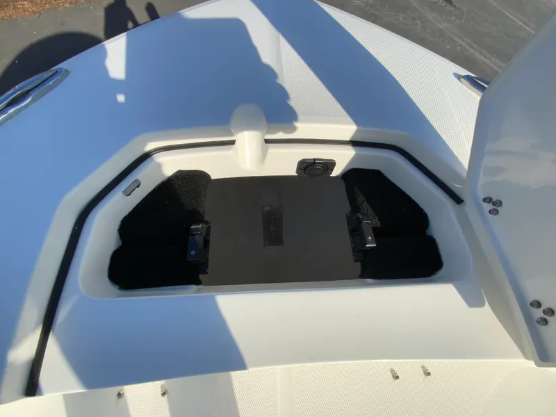 Slide: The Image of 2025 Pathfinder 2400 TRS boat storage compartment with open hatch. - 26