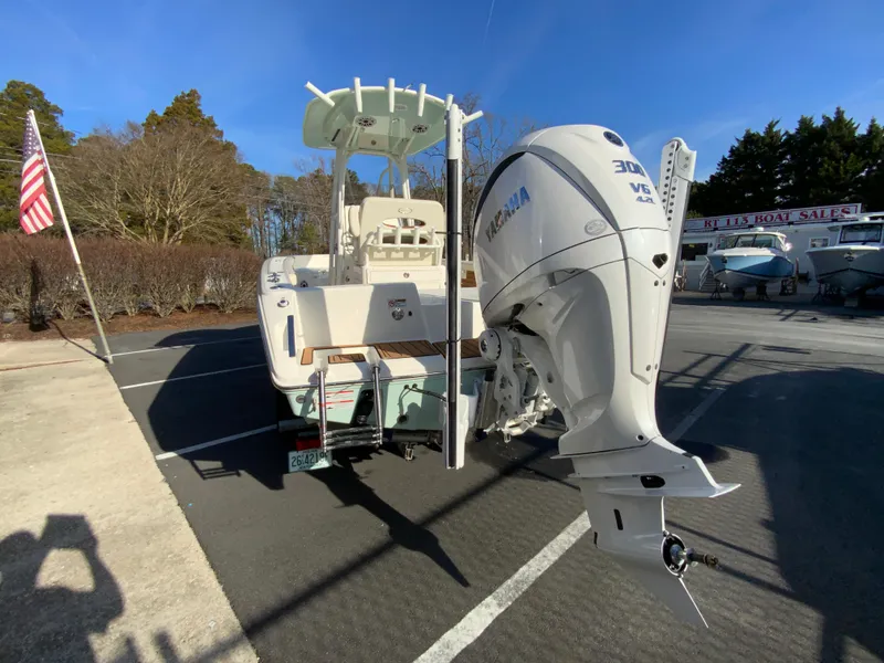 Slide: The Image of 2025 Pathfinder 2400 TRS boat with Yamaha outboard motor in parking lot. - 8
