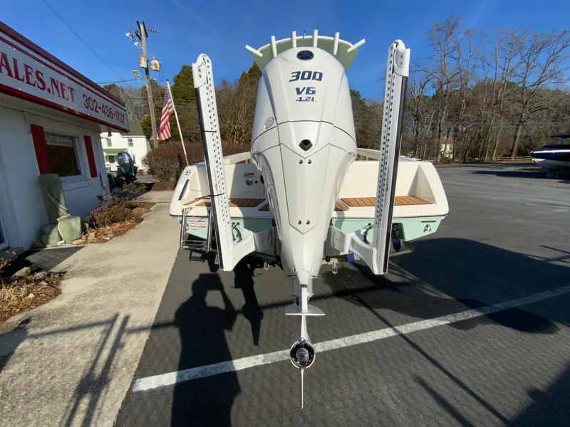 Slide: The Image of 2025 Pathfinder 2400 TRS boat with Yamaha 300 V6 engine in parking lot. - 9