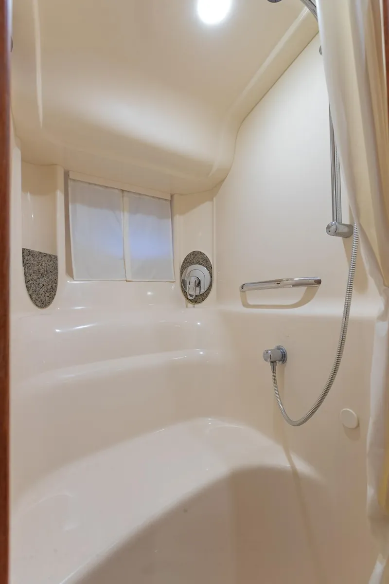 Slide: The Image of Shower area in 2005 Sea Ray 420 Sundancer yacht, featuring modern fixtures and lighting. - 28