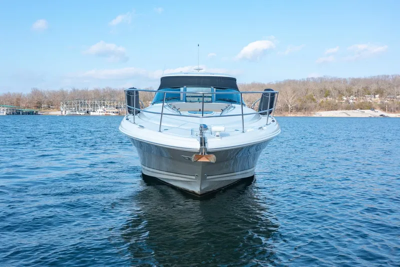 Slide: The Image of 2005 Sea Ray 420 Sundancer yacht on a calm lake. - 4