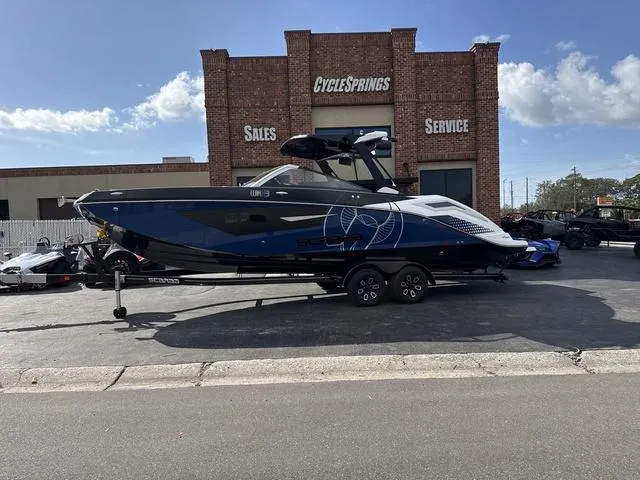 Slide: The Image of 2024 Scarab SBI285 boat parked outside Cycle Springs dealership. - 1