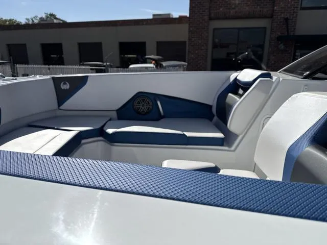Slide: The Image of 2024 Scarab SBI285 boat interior with blue and white seating, modern design. - 23
