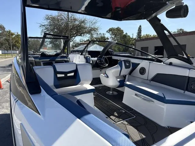 Slide: The Image of 2024 Scarab SBI285 boat interior with modern seating and steering wheel. - 24