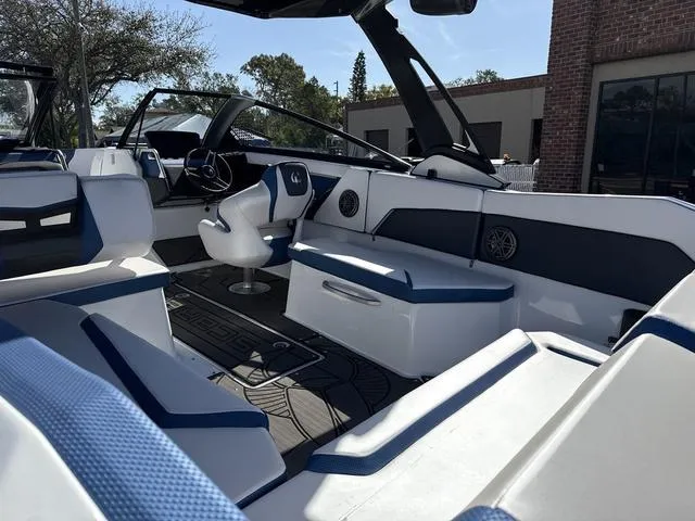 Slide: The Image of 2024 Scarab SBI285 boat interior with modern seating and sleek design. - 25