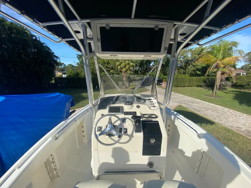 Slide: The Image of 2005 Scout 210 Sportfish boat interior with steering wheel and dashboard. - 19