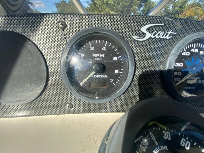 Slide: The Image of Close-up of 2005 Scout 210 Sportfish dashboard with Honda RPM gauge. - 22