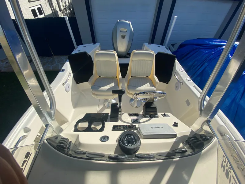 Slide: The Image of 2005 Scout 210 Sportfish boat interior with dual seats and steering console. - 25