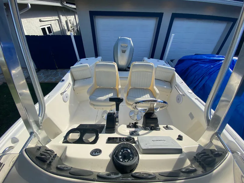 Slide: The Image of 2005 Scout 210 Sportfish boat interior with dual seats and control panel. - 26