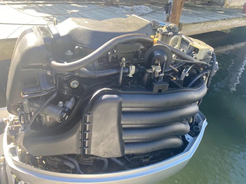 Slide: The Image of 2005 Scout 210 Sportfish engine, detailed view, dockside. - 31