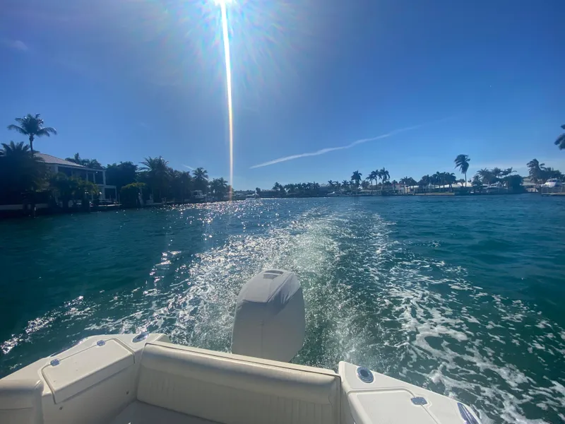 Slide: The Image of 2005 Scout 210 Sportfish cruising on sunny, tropical waters. - 5