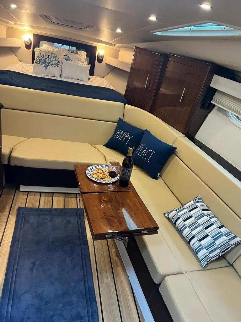 Slide: The Image of Luxurious interior of 2015 Regal 35 Sport Coupe with cozy seating and elegant decor. - 14