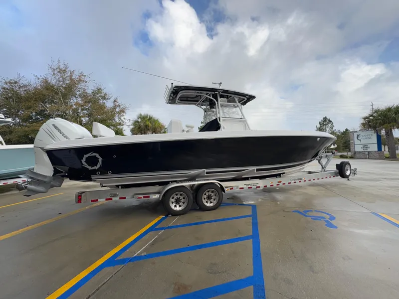 Slide: The Image of 2018 Fountain 34 CC boat on trailer in parking lot. - 12