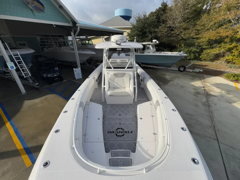 Slide: The Image of 2018 Fountain 34 CC boat docked at marina, top view. - 22