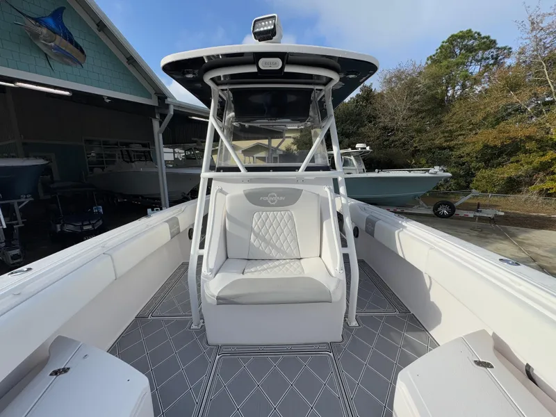 Slide: The Image of 2018 Fountain 34 CC boat with sleek seating and modern design. - 23