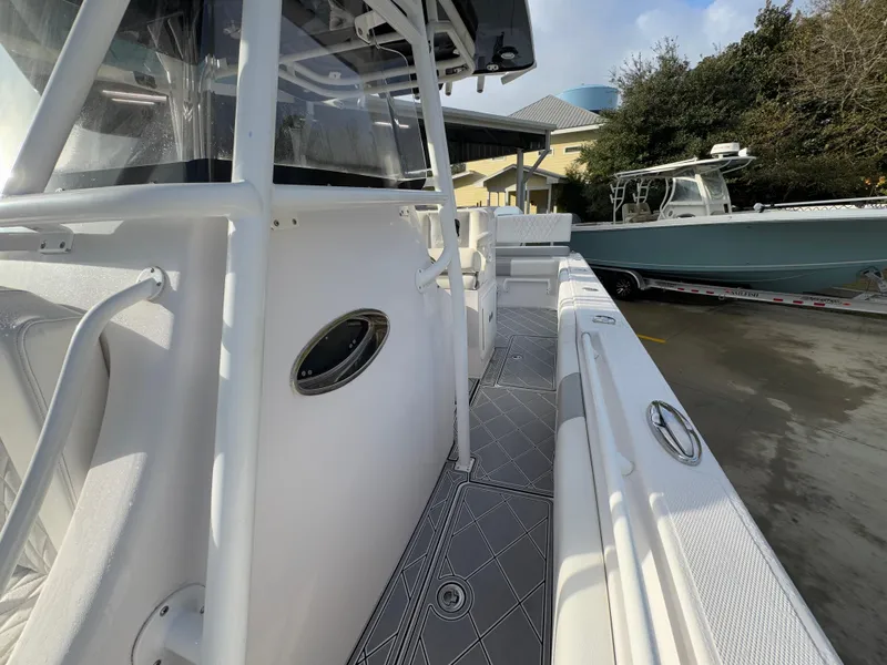 Slide: The Image of 2018 Fountain 34 CC boat, side view, docked with sleek design and modern features. - 24