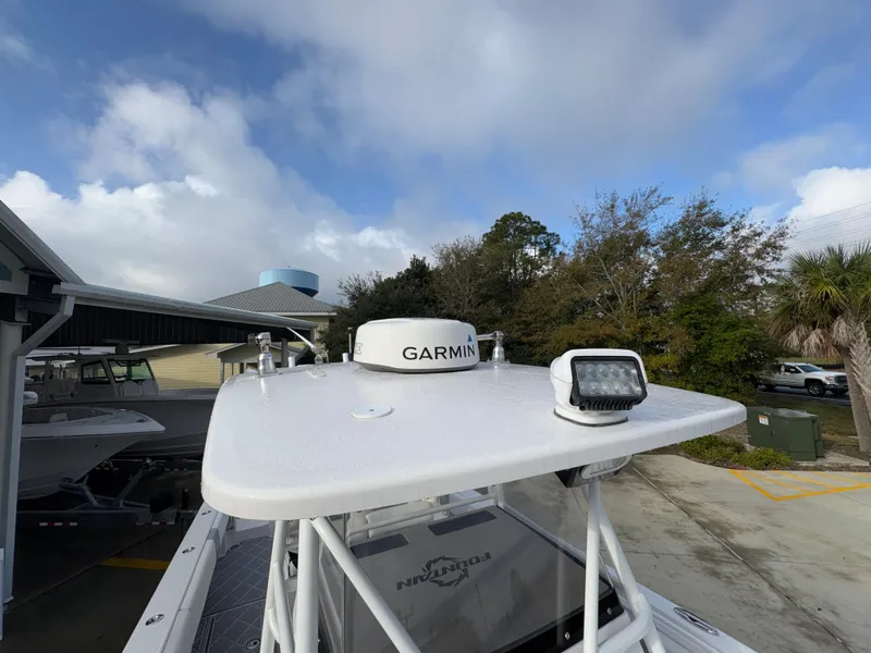 Slide: The Image of 2018 Fountain 34 CC boat with Garmin radar and spotlight on deck. - 26