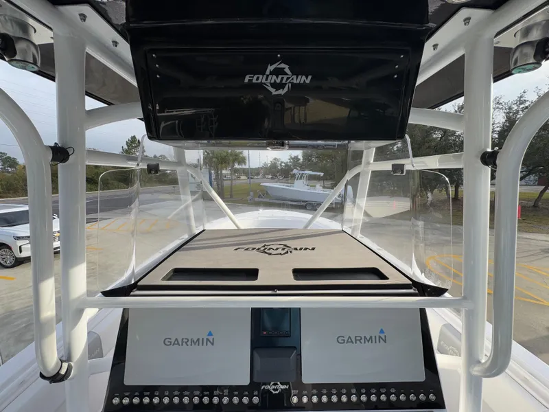 Slide: The Image of 2018 Fountain 34 CC boat dashboard with Garmin navigation system. - 31