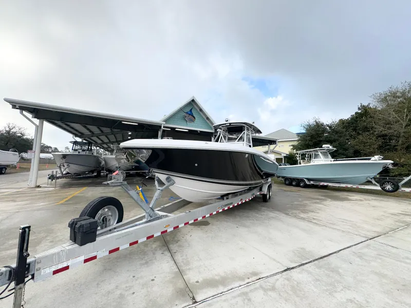 Slide: The Image of 2018 Fountain 34 CC boat on trailer in marina parking lot. - 5