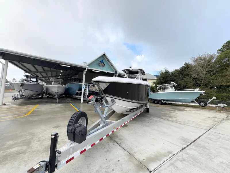 Slide: The Image of 2018 Fountain 34 CC boat on trailer in marina storage area. - 6