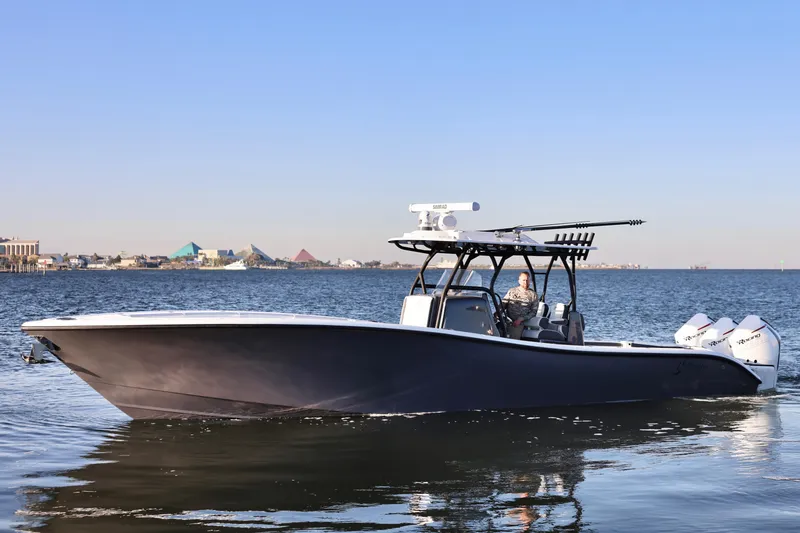Slide: The Image of 2023 Yellowfin 36 Offshore boat cruising on calm waters. - 2