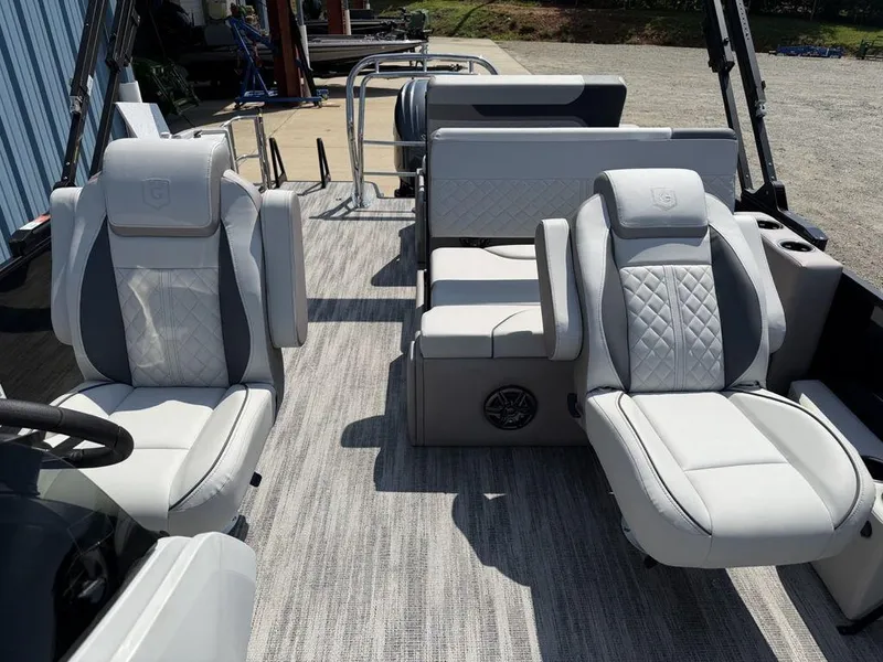 Slide: The Image of 2025 Godfrey Sweetwater 2486 DT boat interior with luxurious seating and modern design. - 12