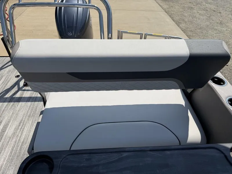 Slide: The Image of 2025 Godfrey Sweetwater 2486 DT boat seating with cup holders and sleek design. - 24