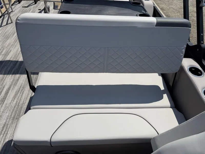 Slide: The Image of 2025 Godfrey Sweetwater 2486 DT boat seating with quilted upholstery and cup holders. - 25