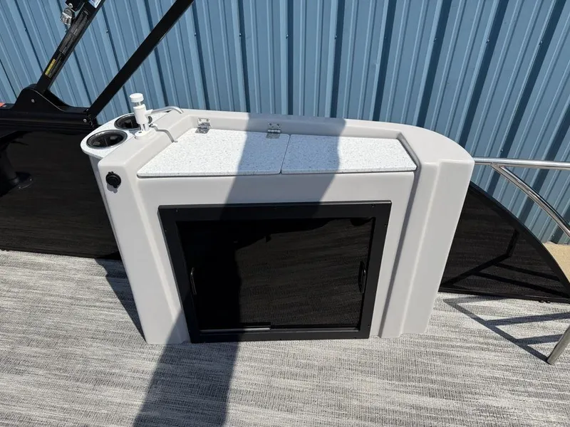 Slide: The Image of 2025 Godfrey Sweetwater 2486 DT boat console with storage and cup holder. - 29