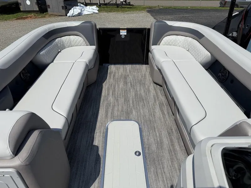 Slide: The Image of 2025 Godfrey Sweetwater 2486 DT boat interior with spacious seating and modern design. - 3