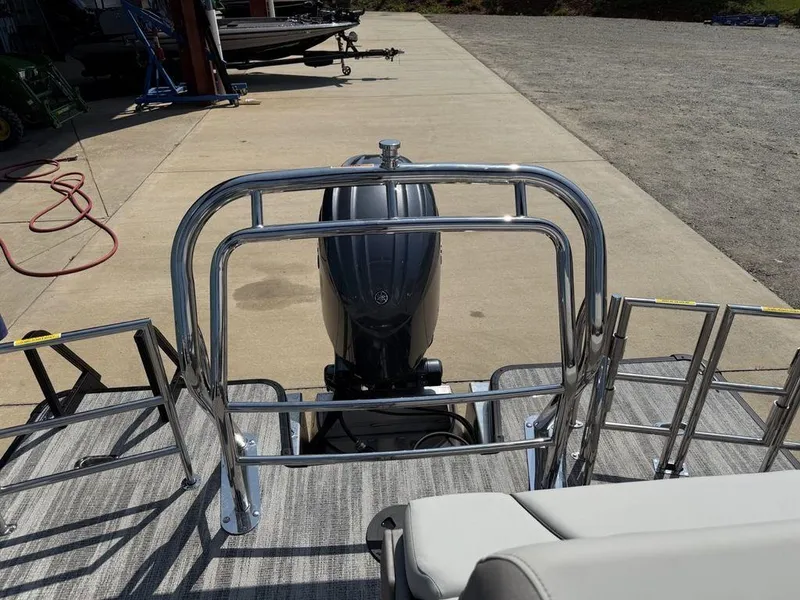 Slide: The Image of Rear view of 2025 Godfrey Sweetwater 2486 DT boat with outboard motor. - 31