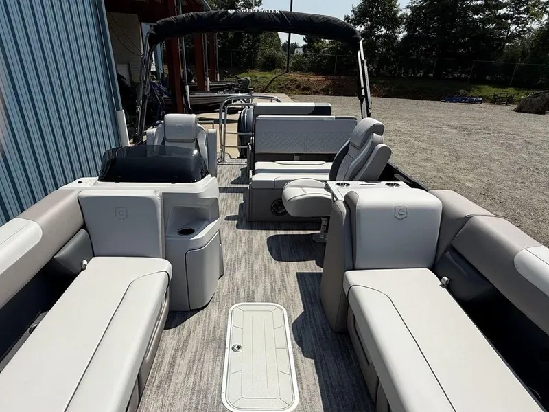 Slide: The Image of 2025 Godfrey Sweetwater 2486 DT pontoon boat interior with spacious seating and modern design. - 34