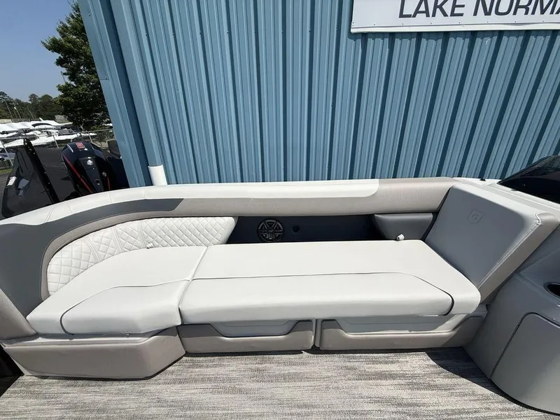 Slide: The Image of 2025 Godfrey Sweetwater 2486 DT boat seating, featuring luxurious white upholstery and modern design. - 5