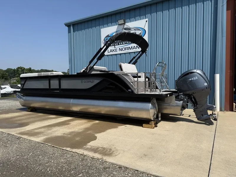 Slide: The Image of 2025 Godfrey Sweetwater 2486 DT pontoon boat with Yamaha motor at Lake Norman dealership. - 6