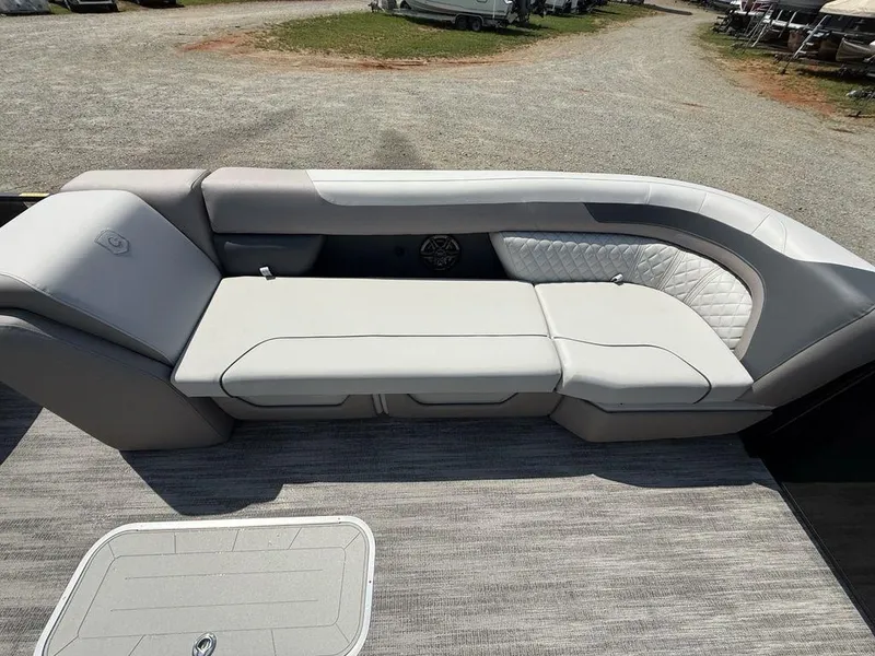 Slide: The Image of 2025 Godfrey Sweetwater 2486 DT boat interior with plush seating and modern design. - 8