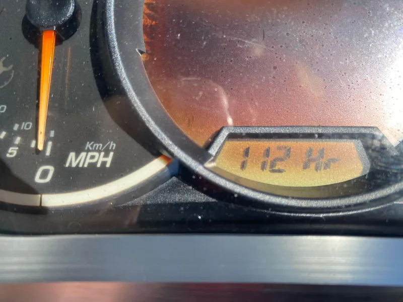 Slide: The Image of Close-up of 2018 Scarab 165 G speedometer showing 112 hours. - 12