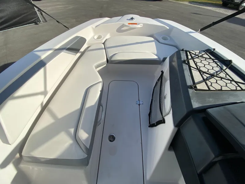 Slide: The Image of 2018 Scarab 165 G boat interior with seating and storage compartments. - 14